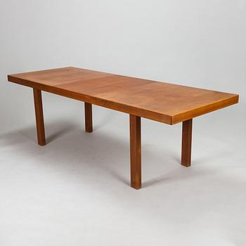 Carl Gustaf Hiort af Ornäs, a mid-20th Century dining table and eight chairs for  för HMN Huonekalu Mikko Nupponen.