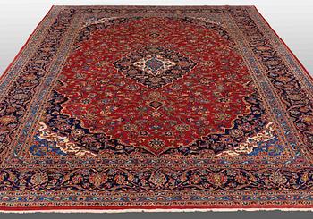 A carpet, Kashan, signed, ca 353 x 287 cm.