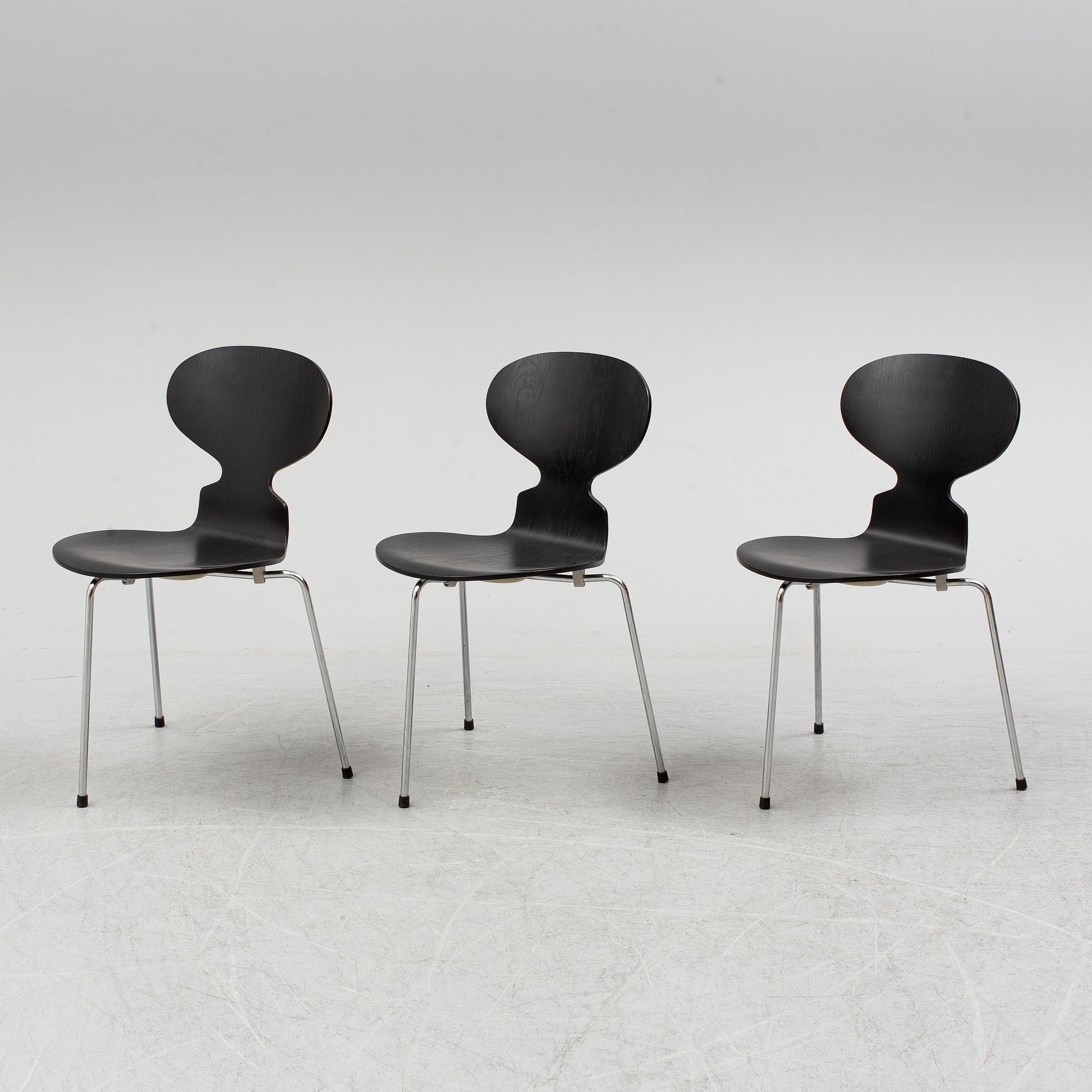 An Arne Jacobsen "Centenary Package" comprising three "Ant Chairs" and an eggshaped table, Fritz Hansen, Denmark.