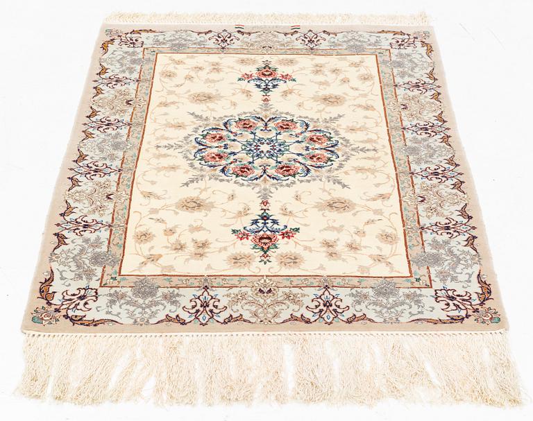 A part silk Isfahan rug, signed, c. 125 x 84 cm.