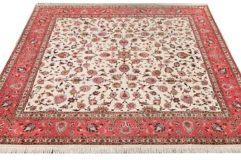 An old Tabriz carpet, part silk, 60 raj, c. 253 x 250 cm.