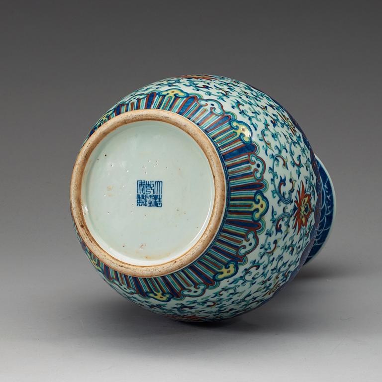 A doucai vase with bamboshaped handles, Qing dynasty, 19th Century, with Qianlong seal mark.
