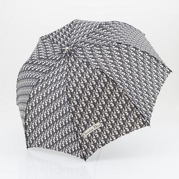 Christian Dior, a black canvas umbrella, toilet bag, coin purse and wallet.