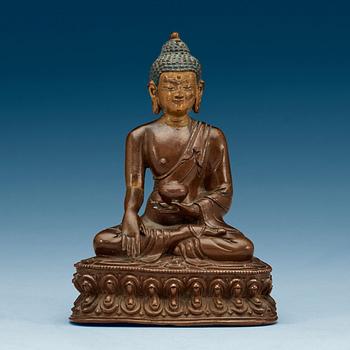 1384. A Tibetan bronze figure of Buddha, presumably 19th Century.