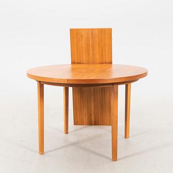 A 1960s teak dining table.