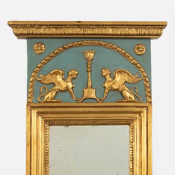 A Swedish giltwood empire mirror, first part of the 19th century.