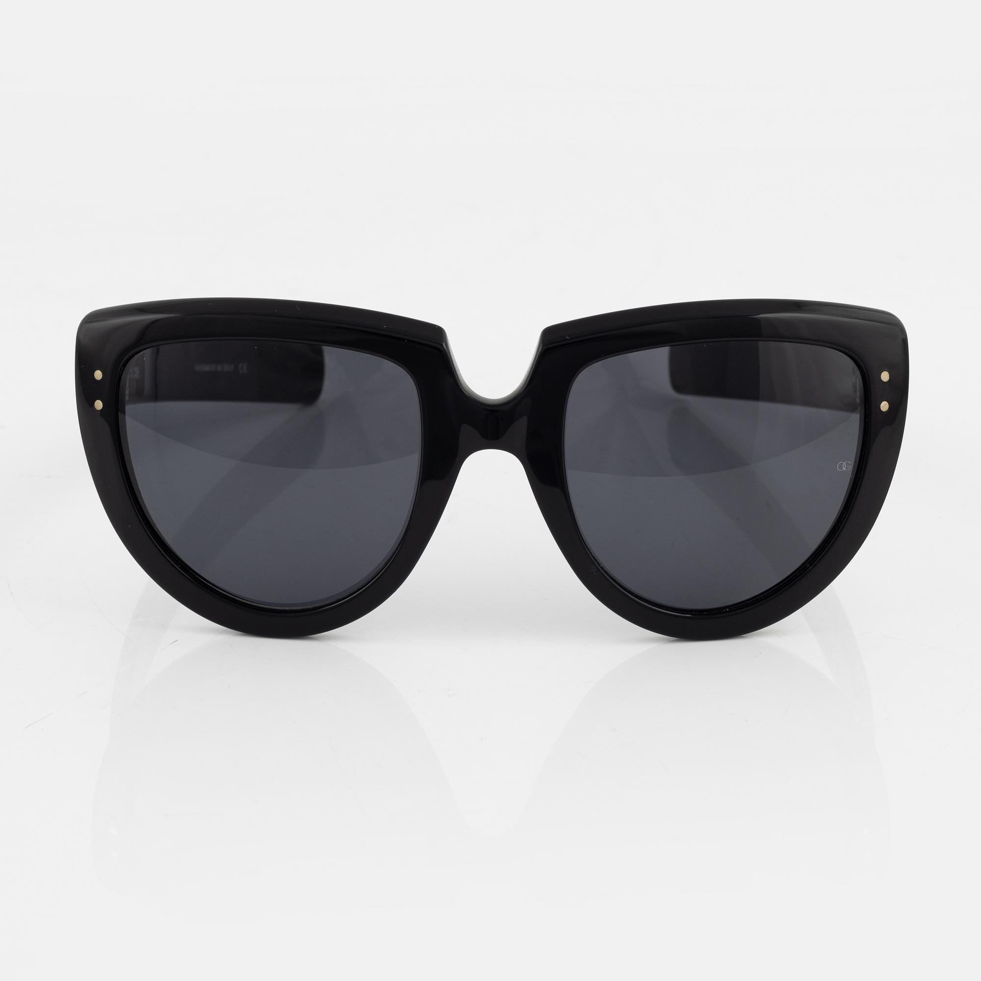 Oliver Goldsmith, a pair of black "Y-not" sunglasses.