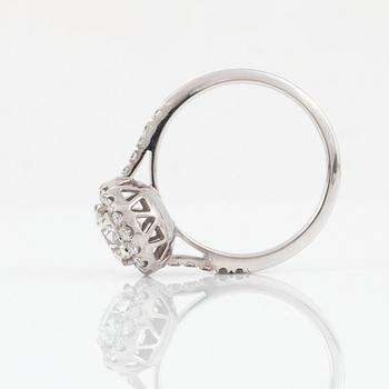 A brilliant-cut diamond ring. Center stone 1.50 cts F/IF according to IGI cert, surrounded by 0.36 ct pavé-set diamonds.