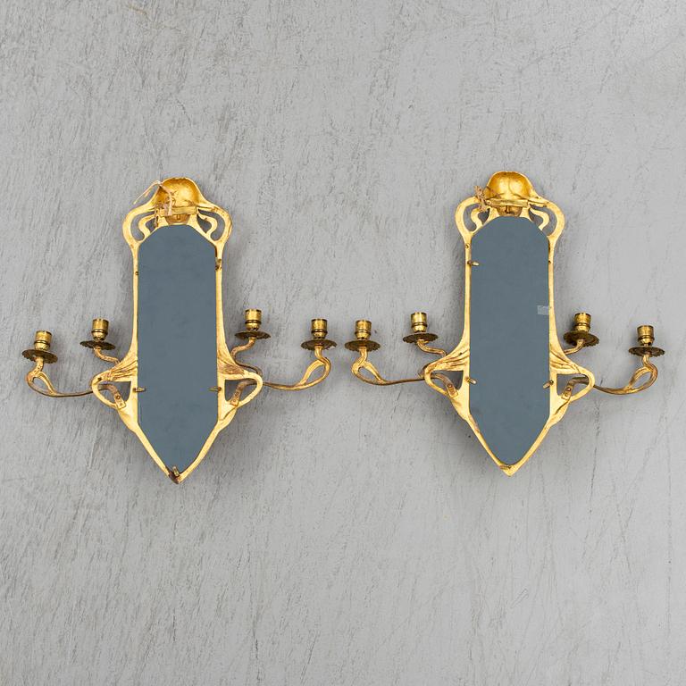 A pair of Art Nouveau mirror wall sconces, easly 20th Century.