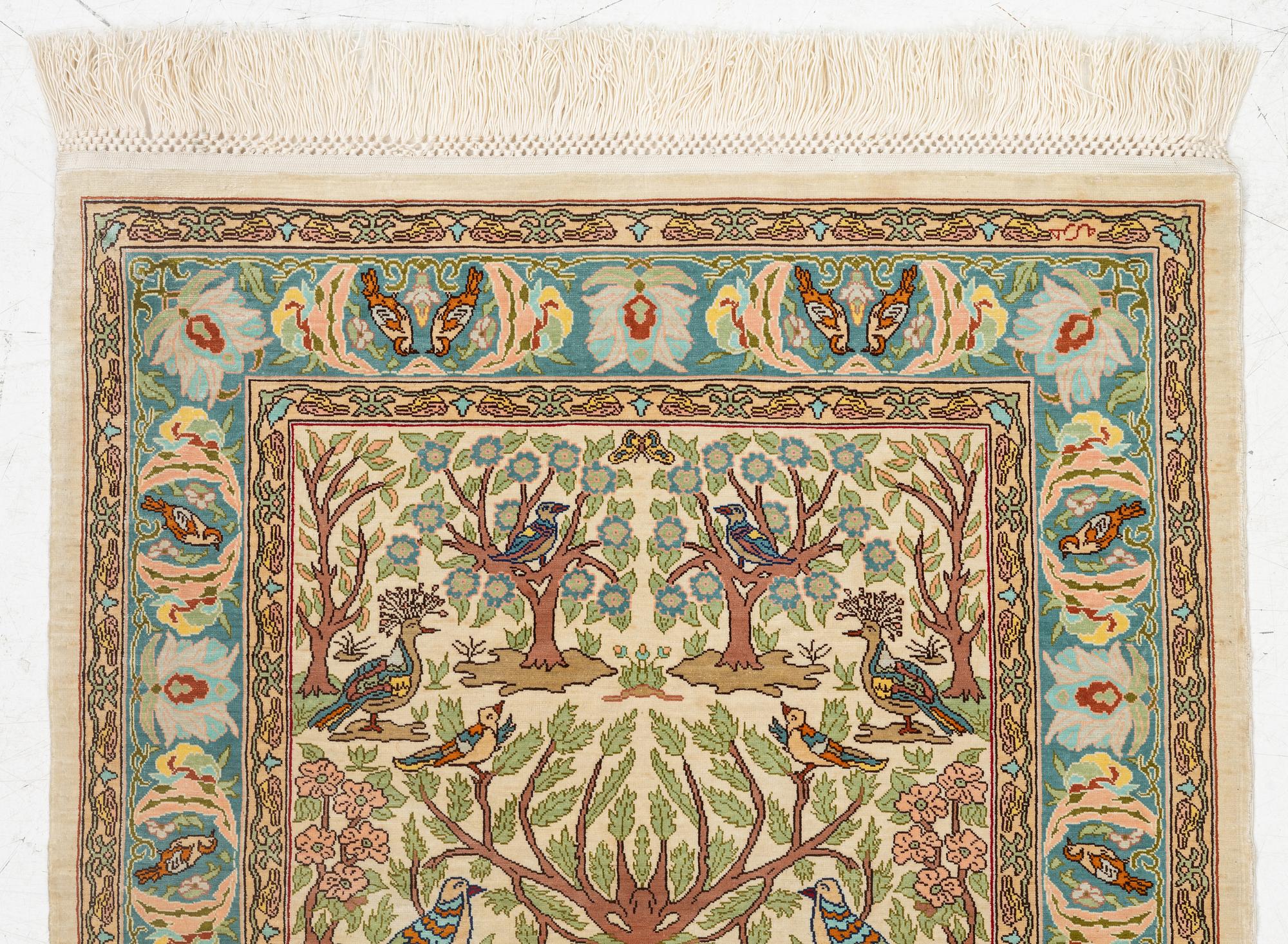 A figural silk Hereke rug, c 65 x 47 cm.