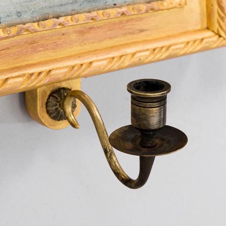 A pair of mirrored wall sconces from the latter half of the 20th century.