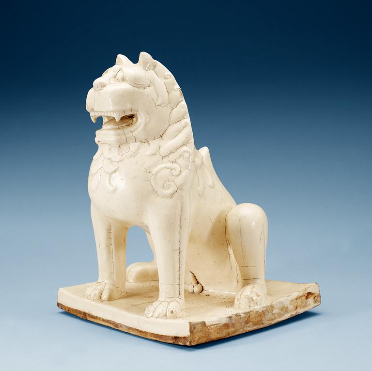 A large white glazed figure of a 'Buddhistic Lion', Qing dynasty, presumably Kangxi (1662-1722).