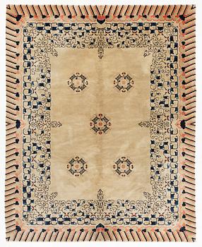 A semi.antique Chinese carpet, c 310 x 228 cm.