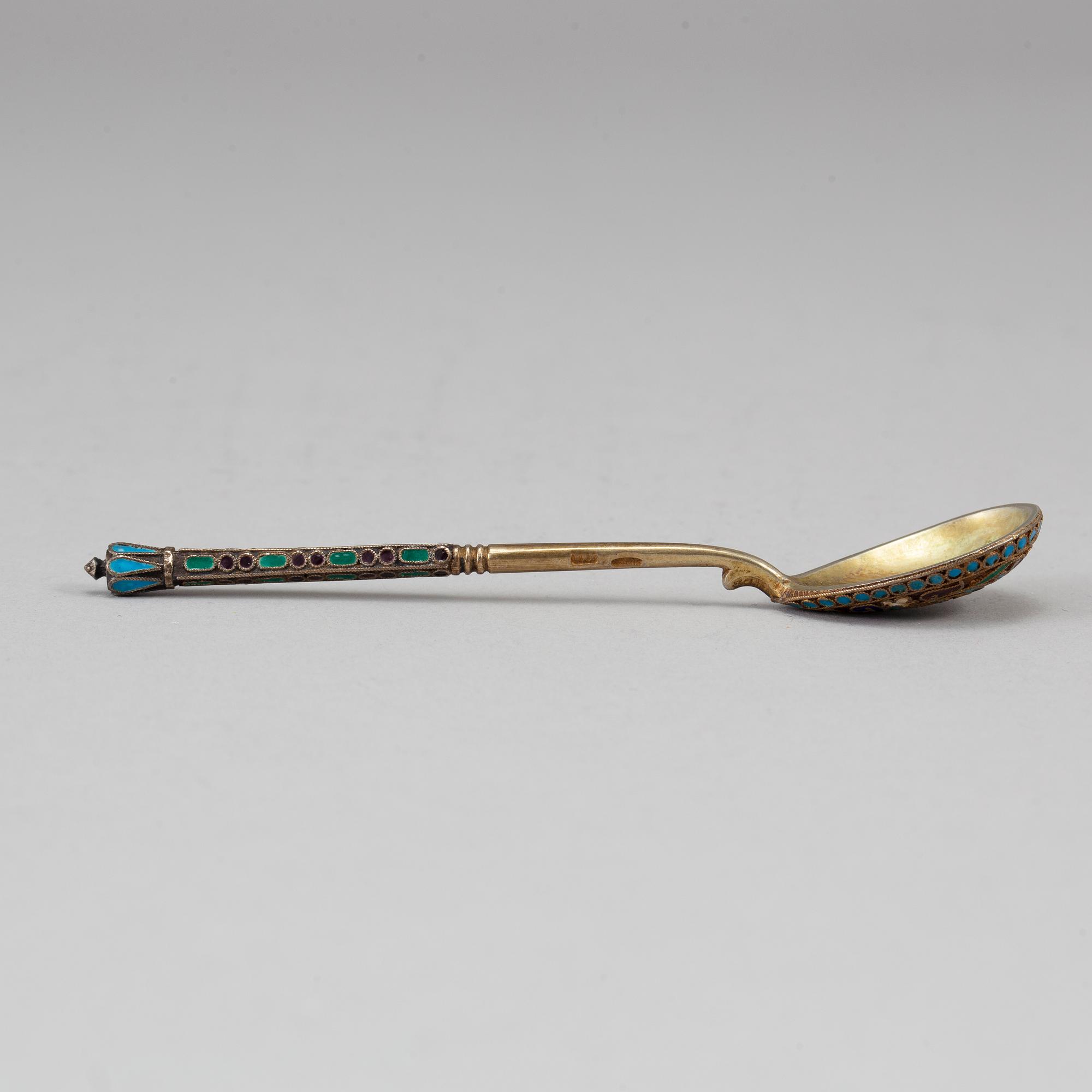 A Russian early 20th century set of ten silver-gilt and enamel tea-spoons, unidentified makers mark, Moscow 1899-1908.
