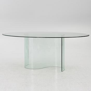 A dining table, glass, contemporary.