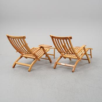 A pair of elm wood lounge chairs, Brogrens, second half of the 20th Century.