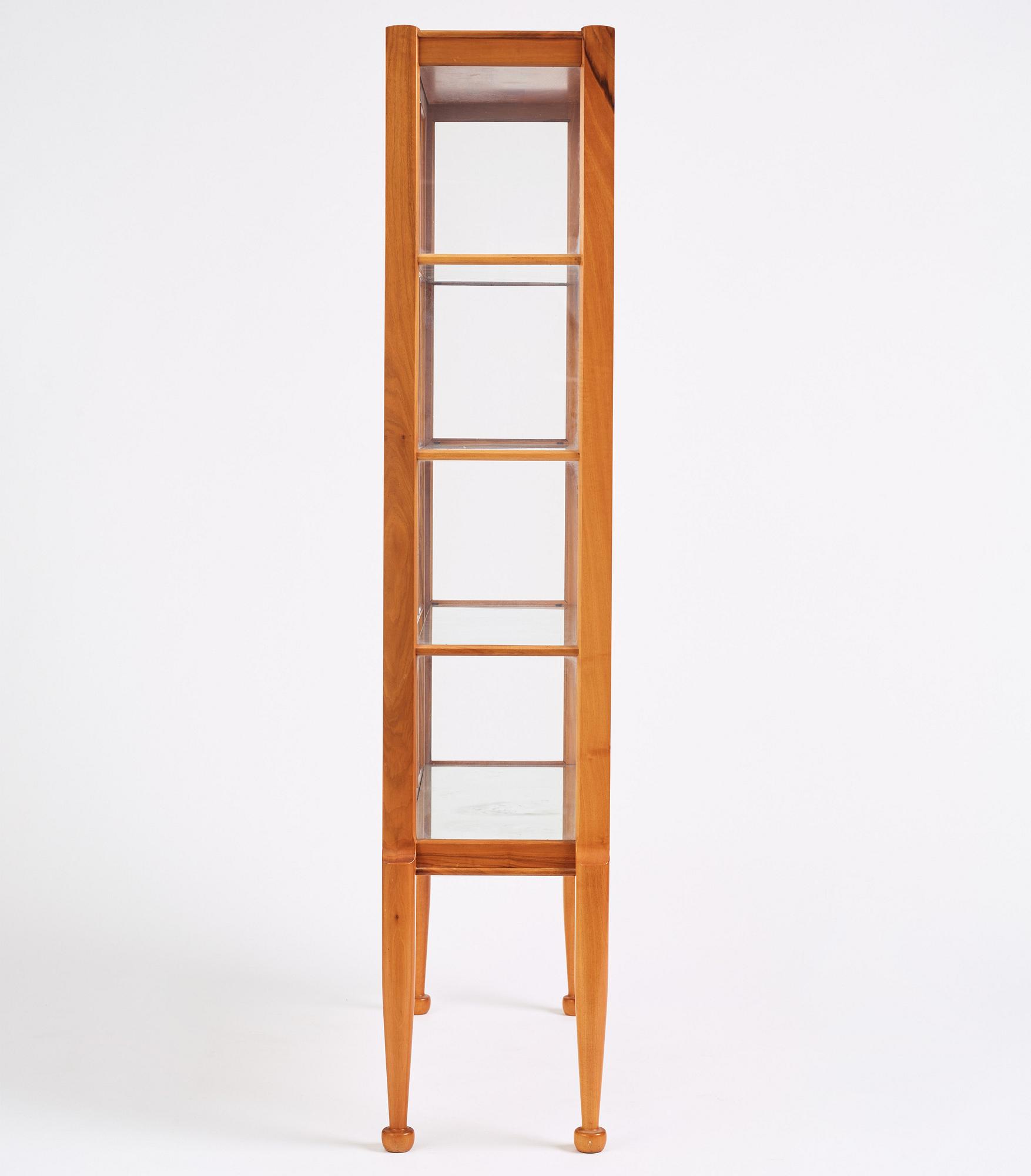 Josef Frank, a walnut showcase cabinet, Svenskt Tenn, Sweden, model B 2217, probably 1950s.