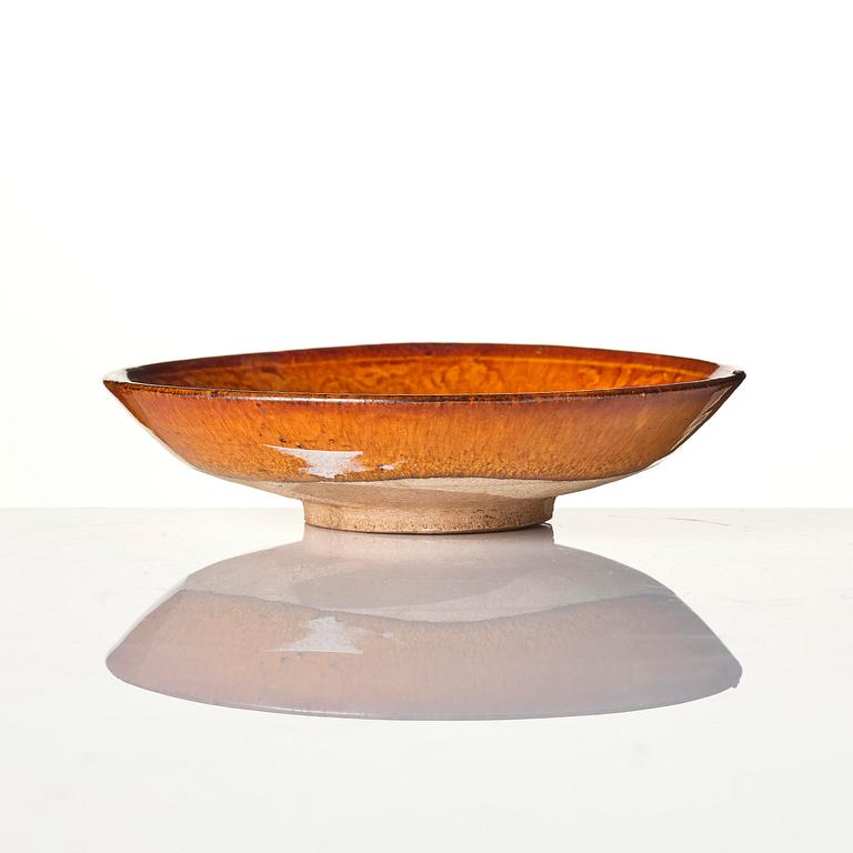 A yellow glazed dish, Liao dynasty (907–1125).