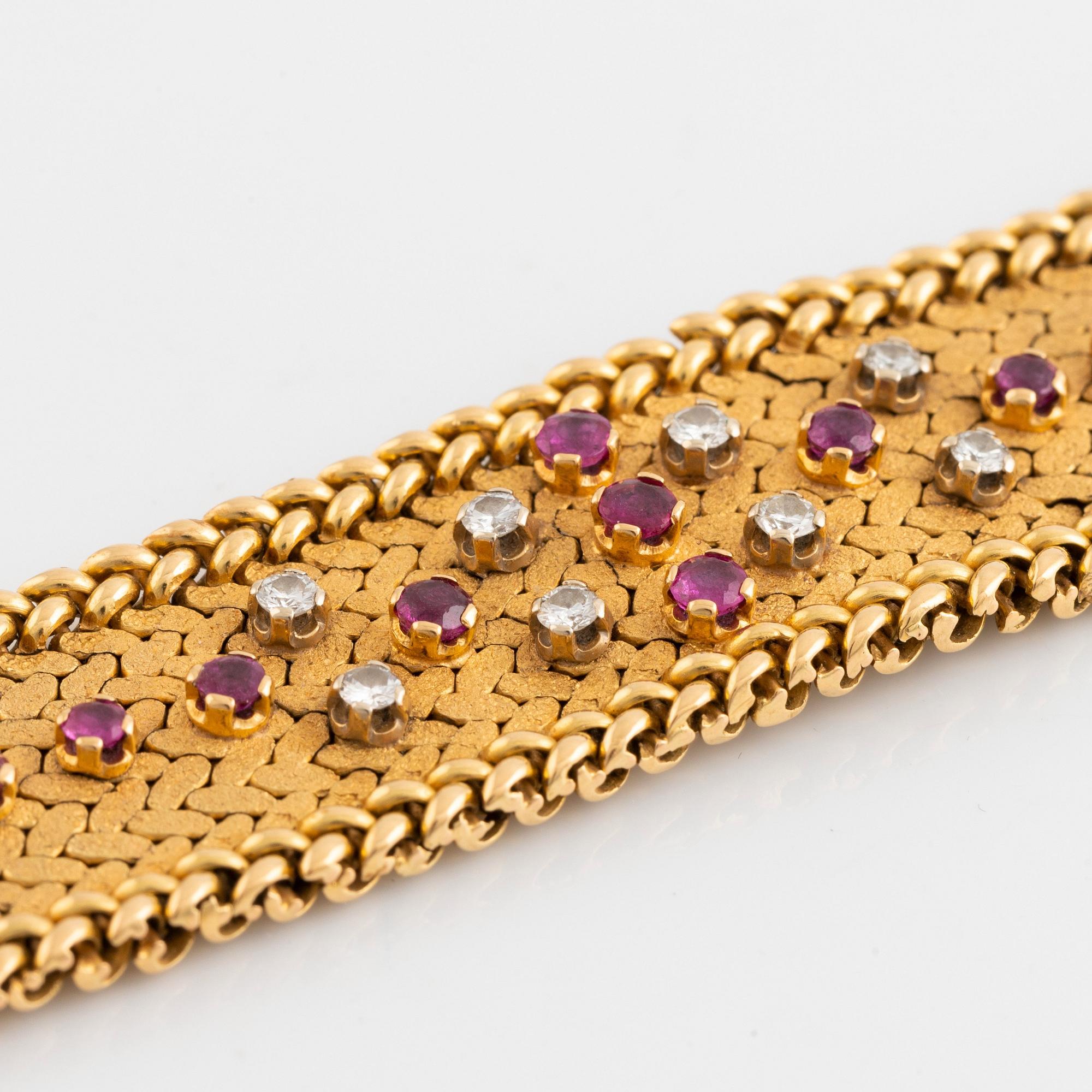 An 18K gold bracelet set with round brilliant-cut diamonds and rubies.