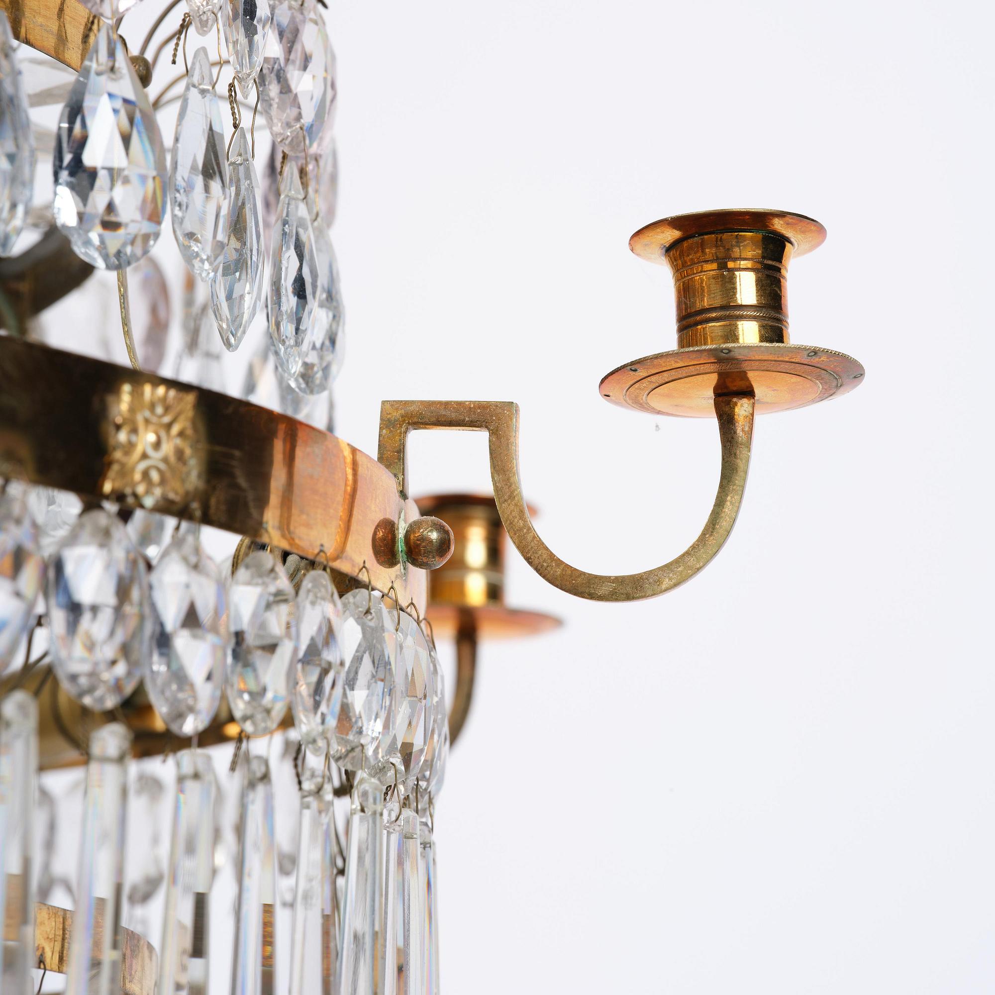 A late Gustavian  gilt-brass and cut-glass eight-branch chandelier, Stockholm, late 18th century.