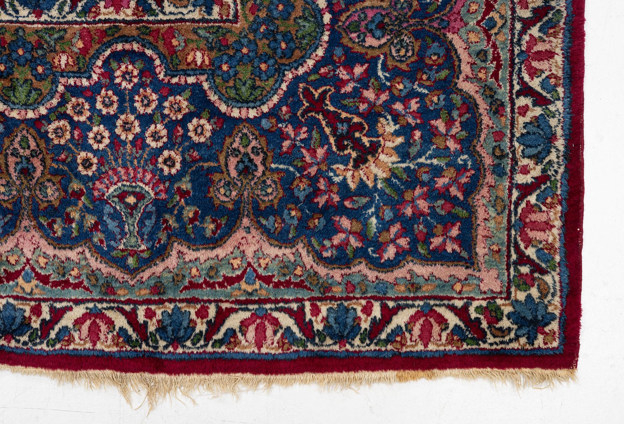 A Kerman carpet, c. 365 x 265 cm.