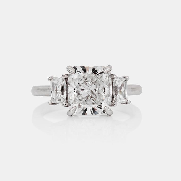 A 3.30 ct D/VVS2, cushion-cut diamond ring. Quality according to GIA certificarte. Side stones 0.67 ct in total.
