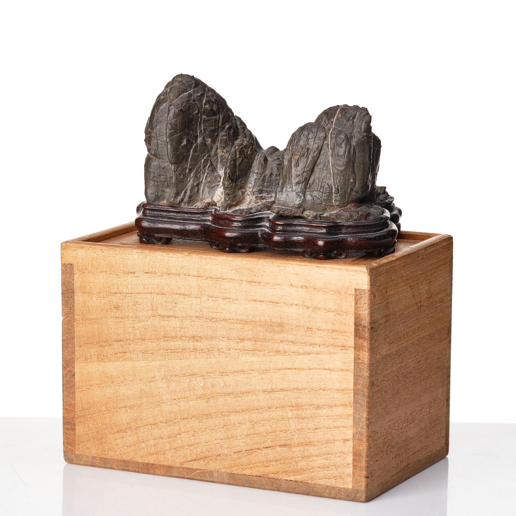 A Japanese rock sculpture, 20th Century. Signed at the base.