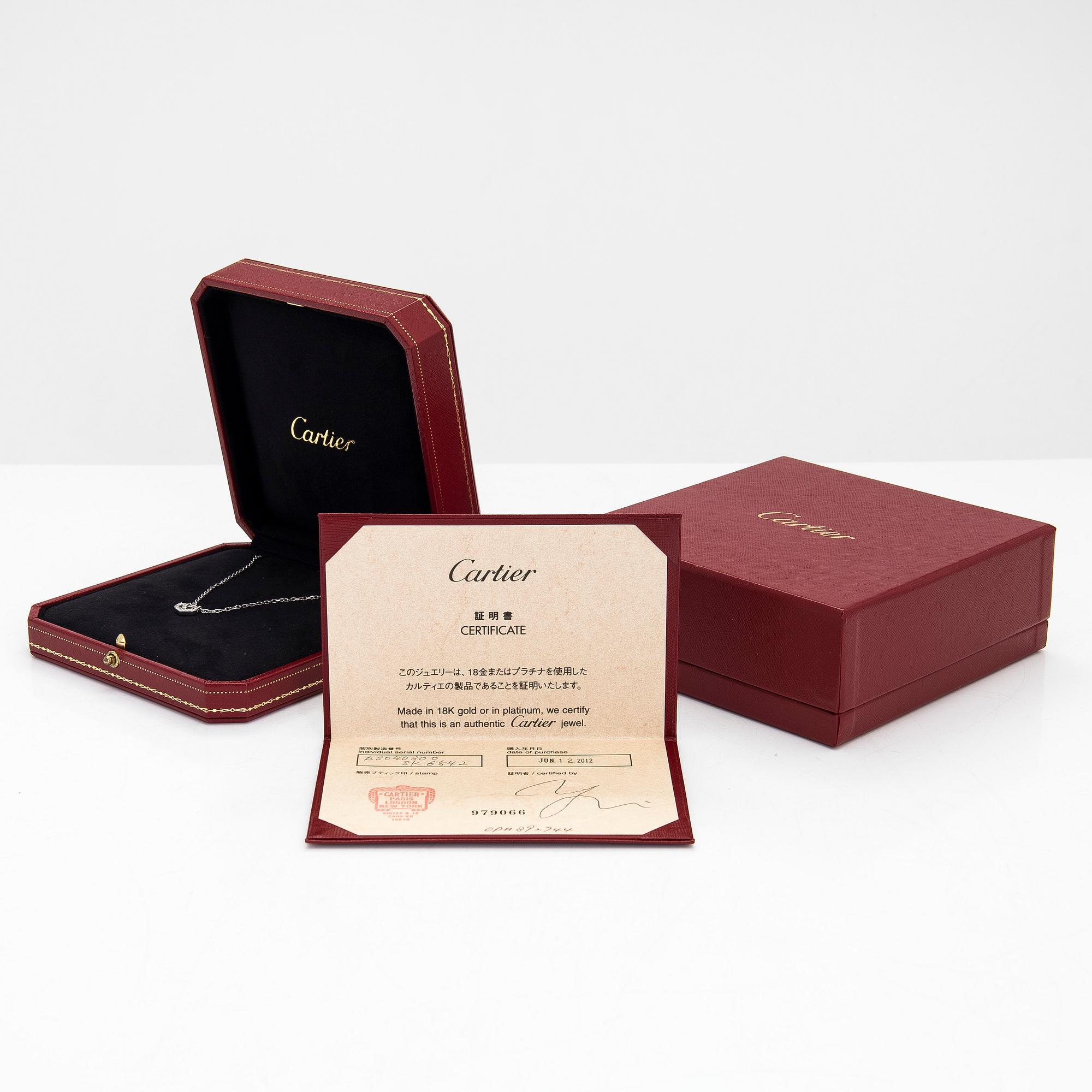 Cartier, an 18K white gold 'C Heart of Cartier' necklace with diamonds approx. 0.09 ct in total.