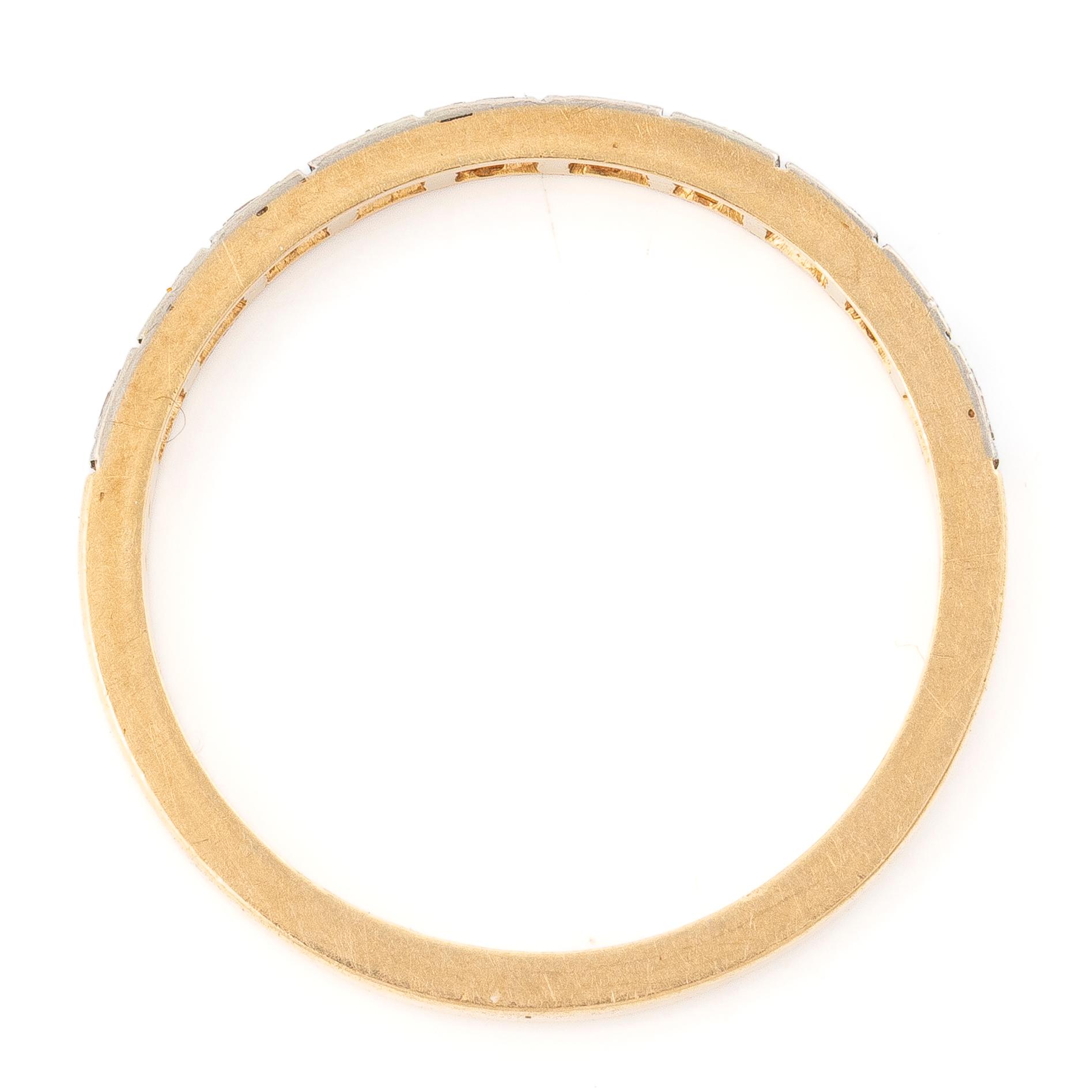 18K gold half-eternity ring with octagonal-cut diamonds.