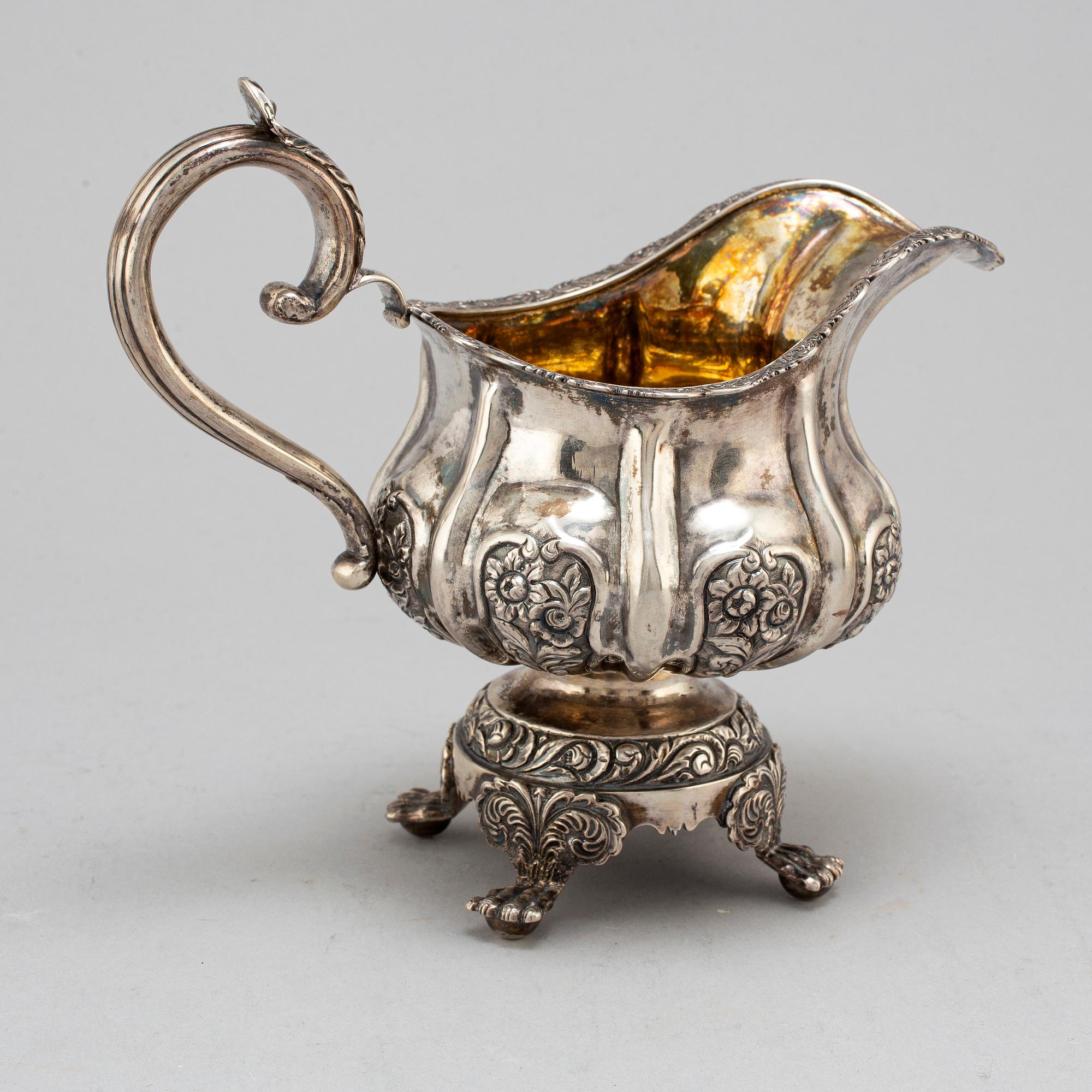 A Russian parcel-gilt silver creamer,  1842, probably Moscow.