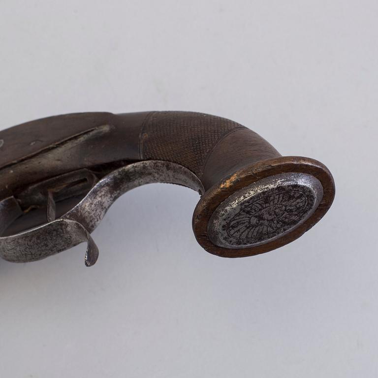 A 19th century percussion pistol.