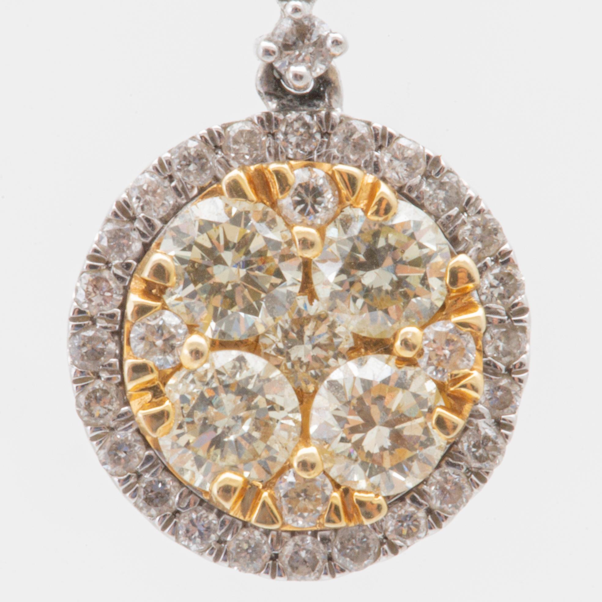 Earrings in 14K white and red gold with round brilliant-cut diamonds.