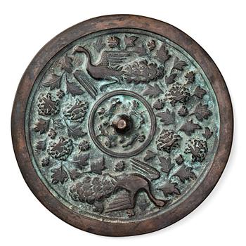 A large bronze mirror, Yuan/Mingdynasty, 13th/14th Century.