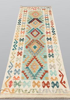 A Kilim runner, approx. 294 x 91 cm.