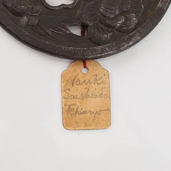 A Japanese iron Tsuba, Edo, signed Nanki Seishindo.