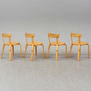 ALVAR AALTO, a table with four model 69 chairs, Artek.