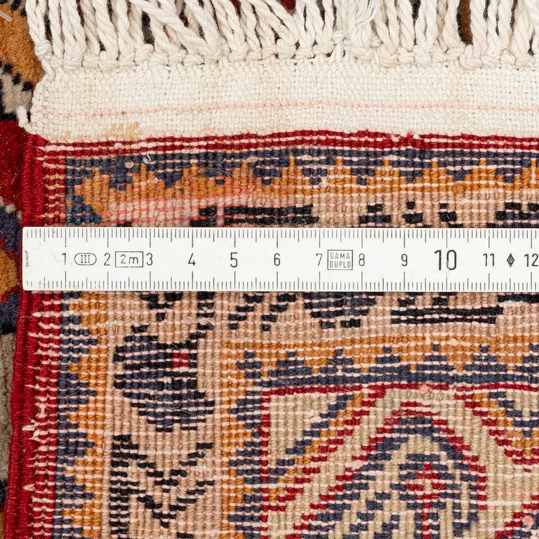 A rug, 215 x 130 cm.