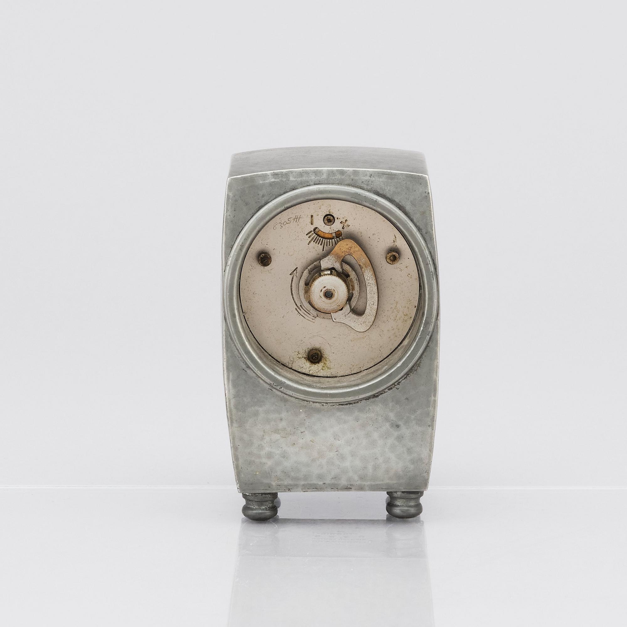 An Arts & Crafts Liberty & Co Tudric pewter and enamel timepiece, model no.0756.