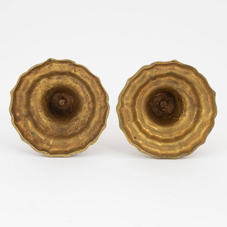 A pair of French brass candles sticks, 19th Century.