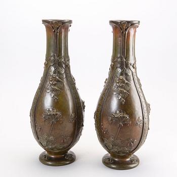 A pair of Japanese 20th century bronze vases.