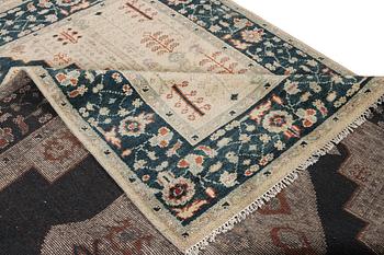 An oriental carpet with Mamluk design, a. 307 x 237 cm.