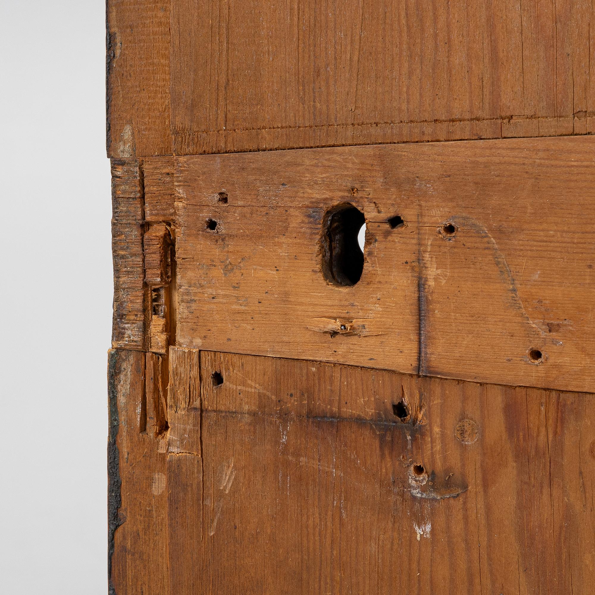 A corner hanging cabinet, dated 1844.