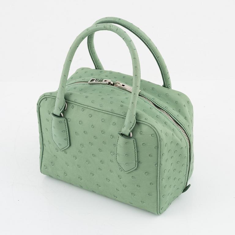 Prada, a green ostrich leather bag.