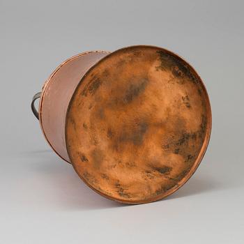 A 19th century copper pot with lid and handle.