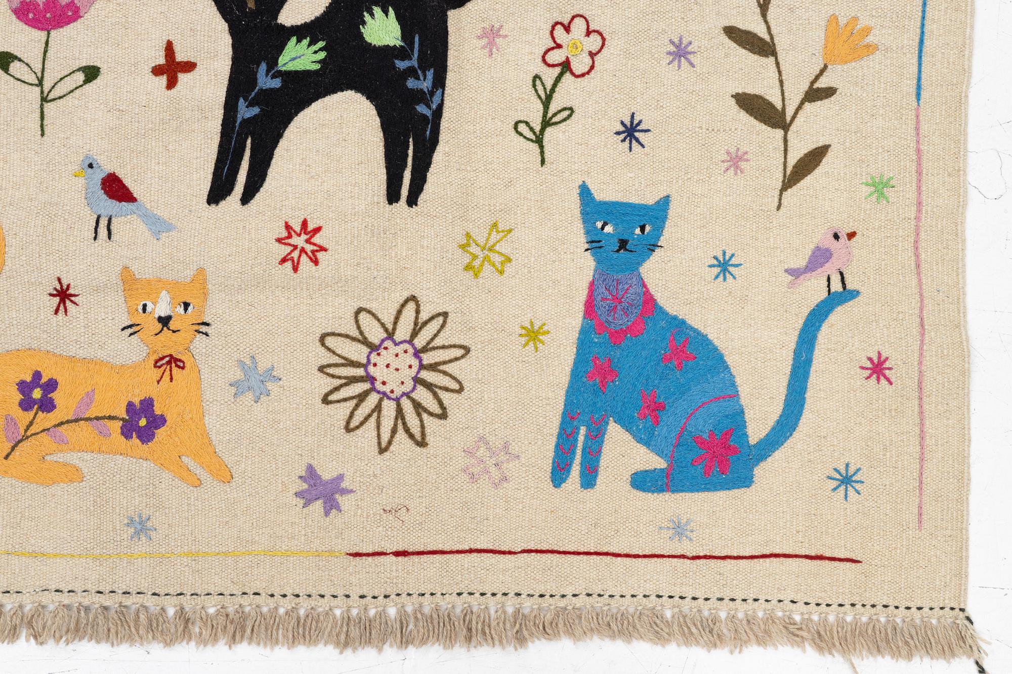 A hand-embroidered Kelim rug, 180 x 122 cm.