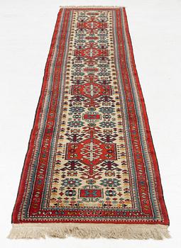 An oriental runner, c. 355 x 75 cm.