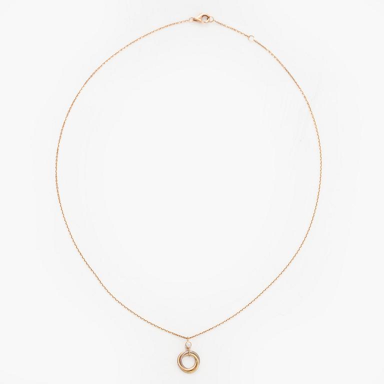 Cartier, an 18K gold 'Trinity Pendant' necklace with a brilliant-cut diamond.
