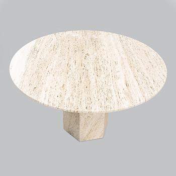 A travertine  'Epic Dining Table' from Gubi.