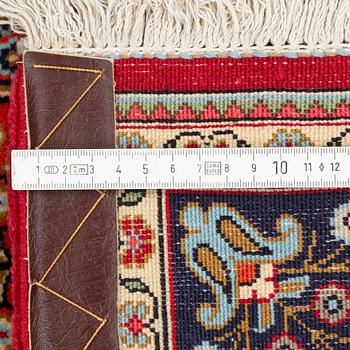 A Quum rug, ca 152 x 106 cm.