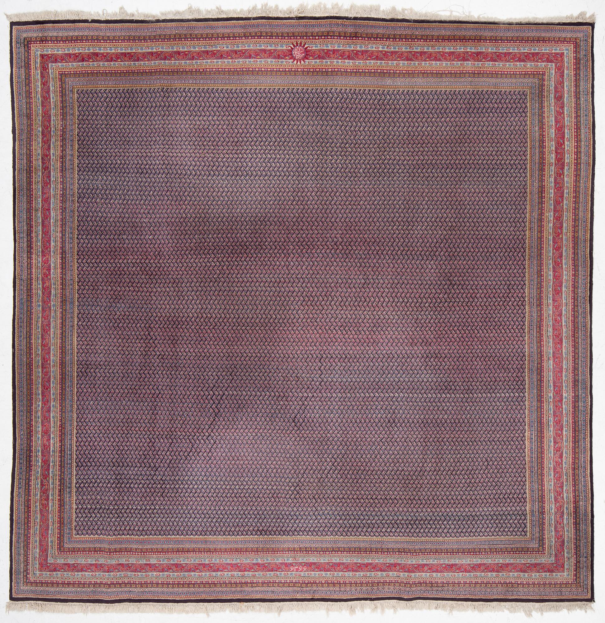 A oriental carpet, signed, c. 295 x 295 cm.